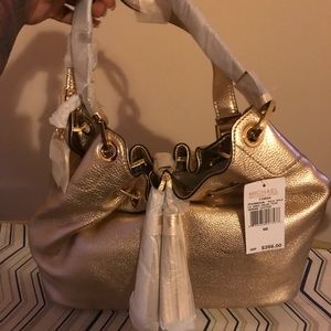 Gold Michael Korda purse. NWT